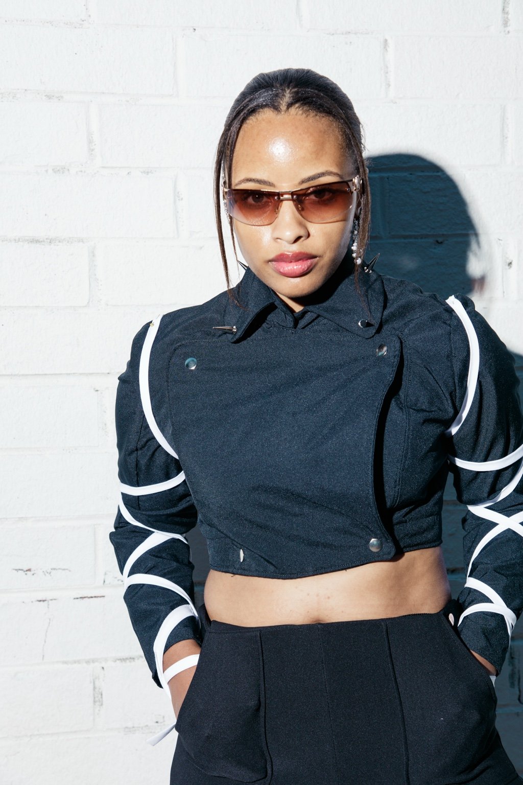 Jasmine in a black editorial outfit