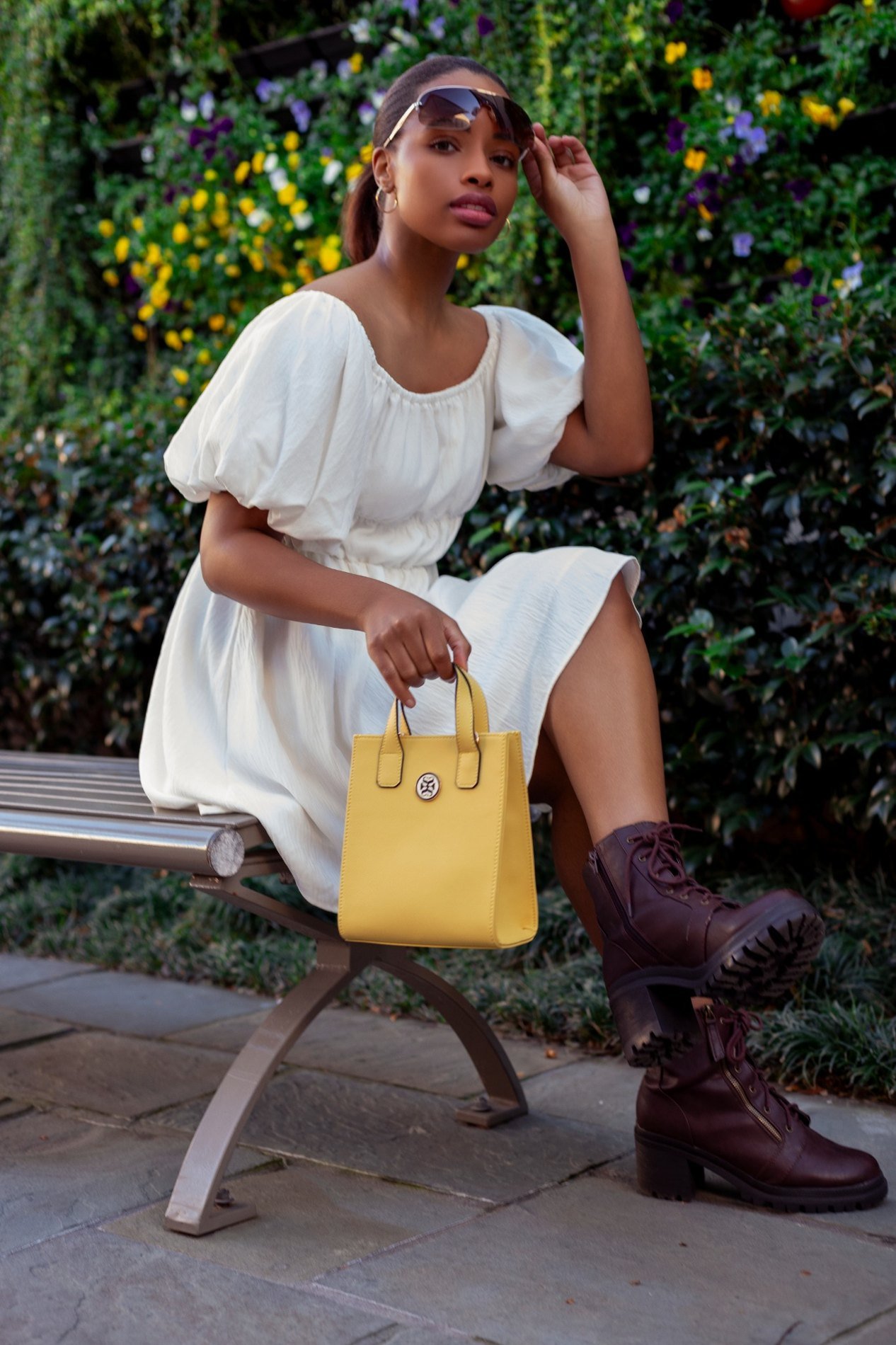 Jasmine with yellow handbag in an outdoor lifestyle setting