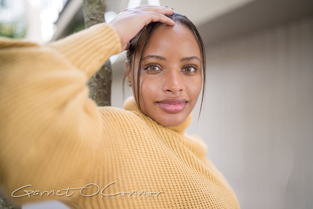 Jasmine in a yellow sweater
